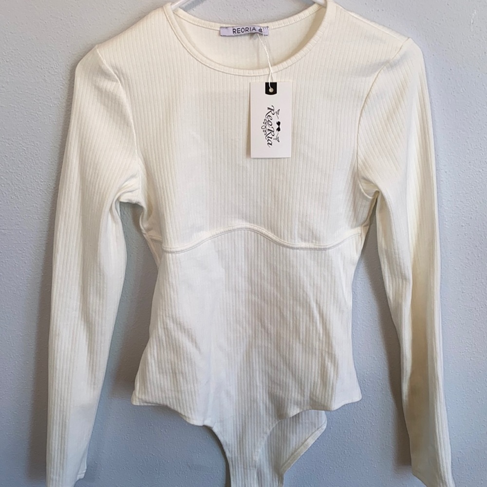 Cream bodysuit. Size M. Tags still attached. Fits like small